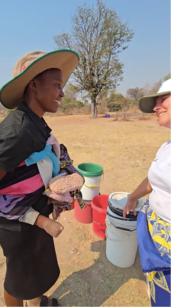 Sympathy Mola talking with Wendy Kroeker.